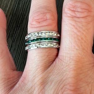 3 eternity bands - 1 green and 2 clear, all in silver tone, size 7